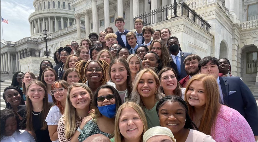 youth tour students posing for selfie on Capitol steps