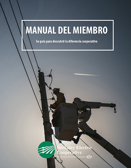 New member booklet cover with lineman working on pole
