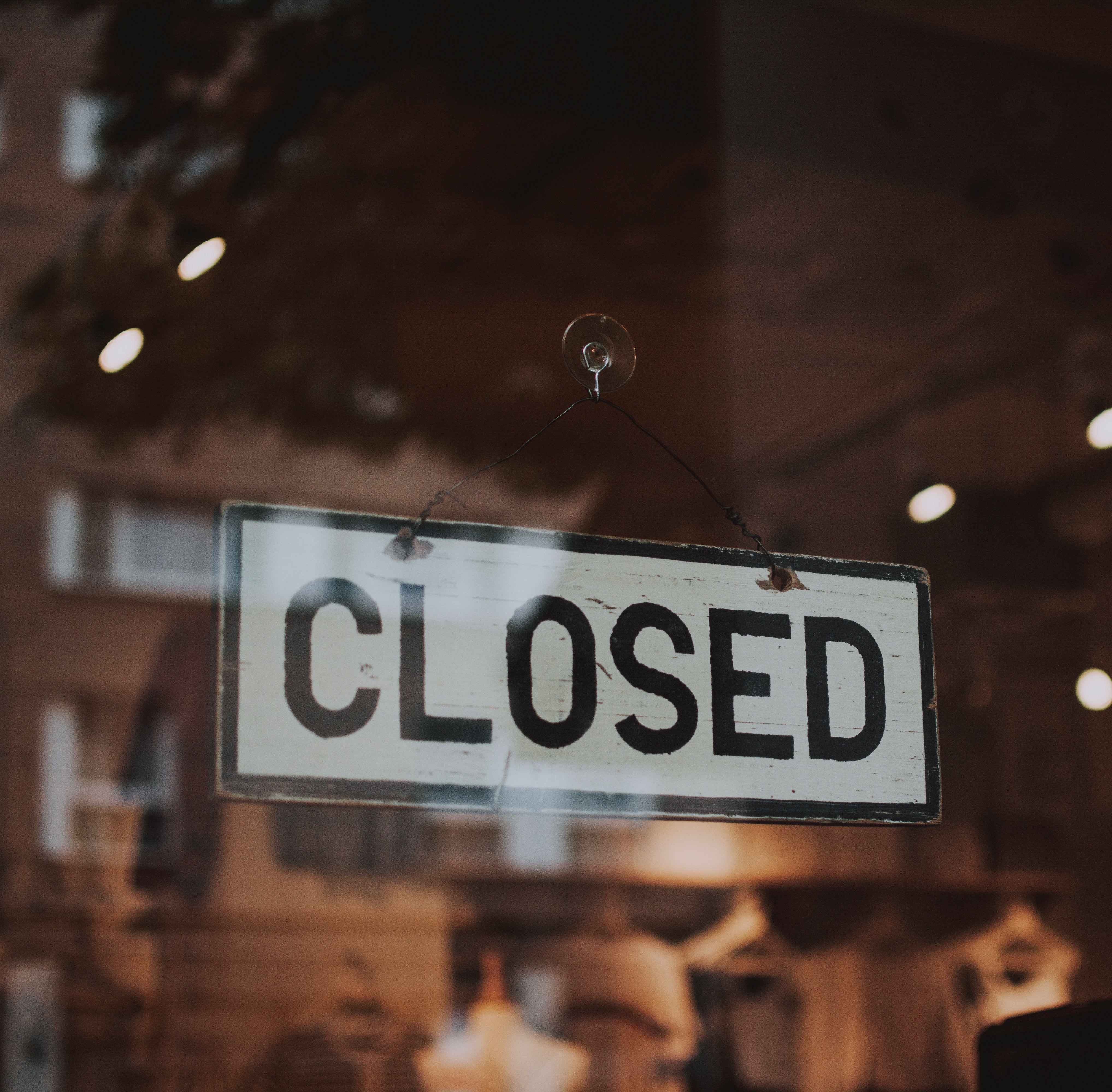 photo of closed sign in store window